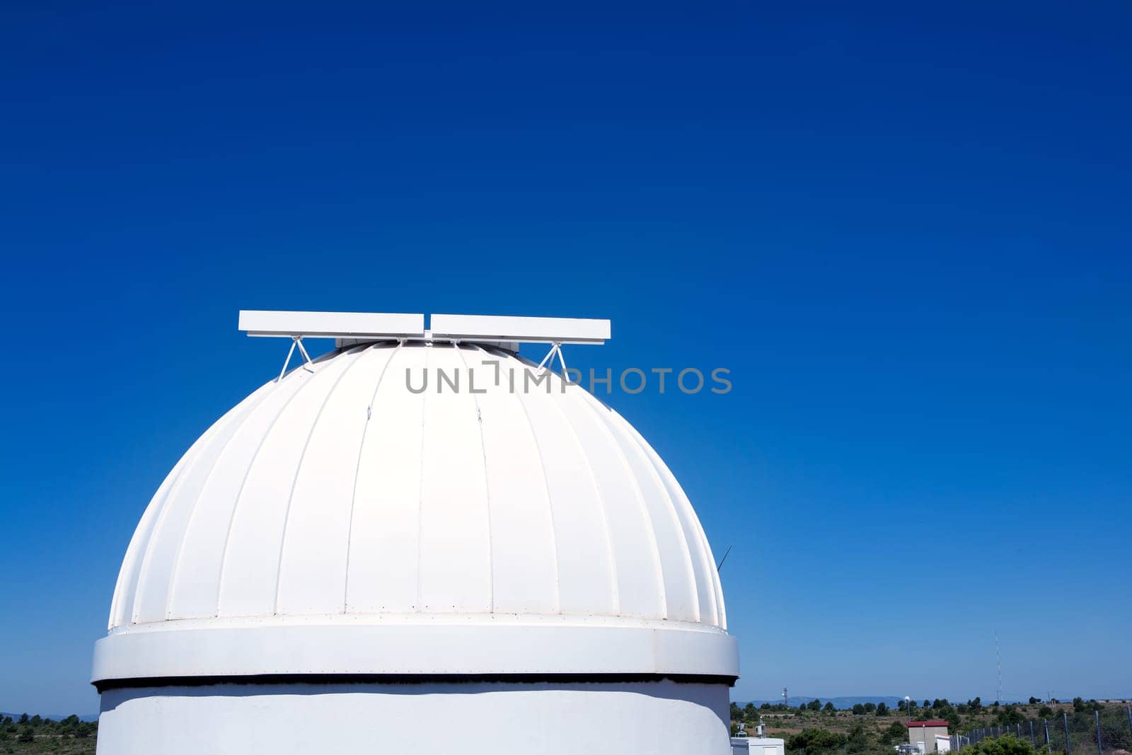astronomical observatory dome in blue sky daylight