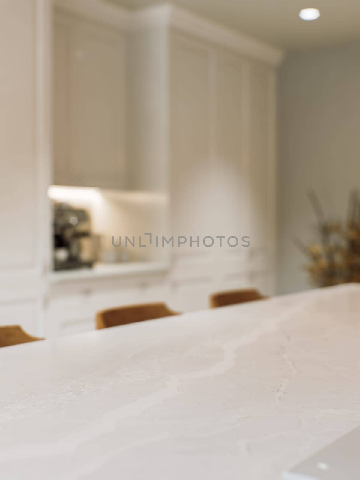 Kitchen white countertop with white marble, with blurred bokeh background. Presentation of goods in the kitchen interior on the countertop surface. 3D rendering