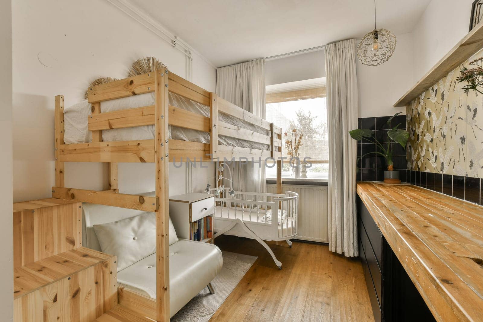 a room with bunk beds and a crib in it by casamedia