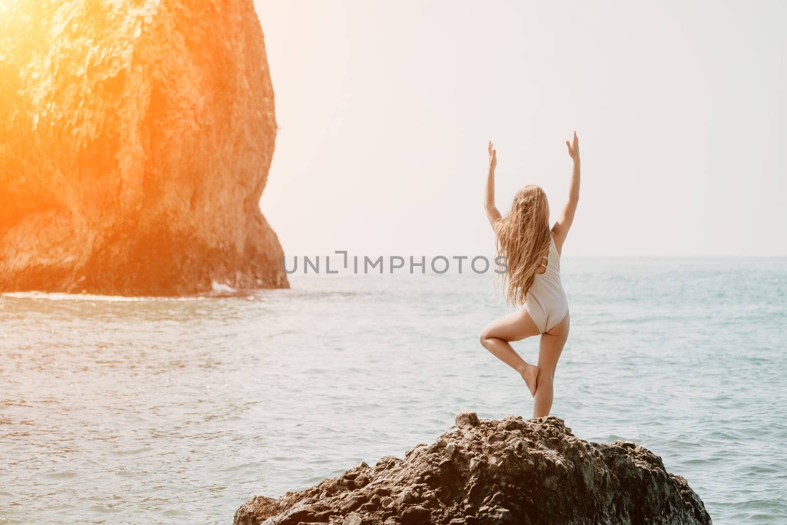 Silhouette mother and daughter doing yoga at beach. Woman on yoga mat in beach meditation, mental health training or mind wellness by ocean, sea