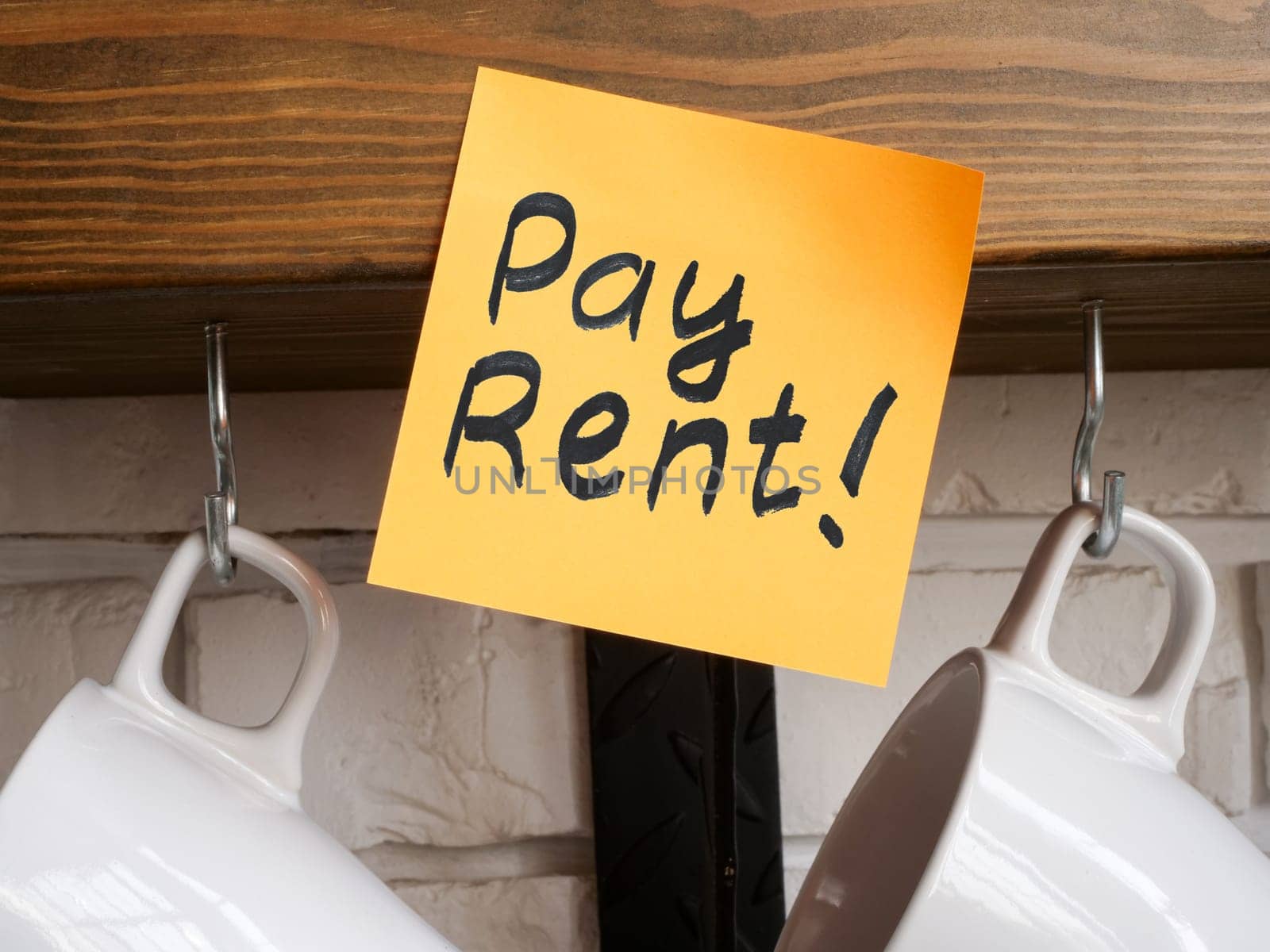 Pay rent reminder attached to the shelf. by designer491