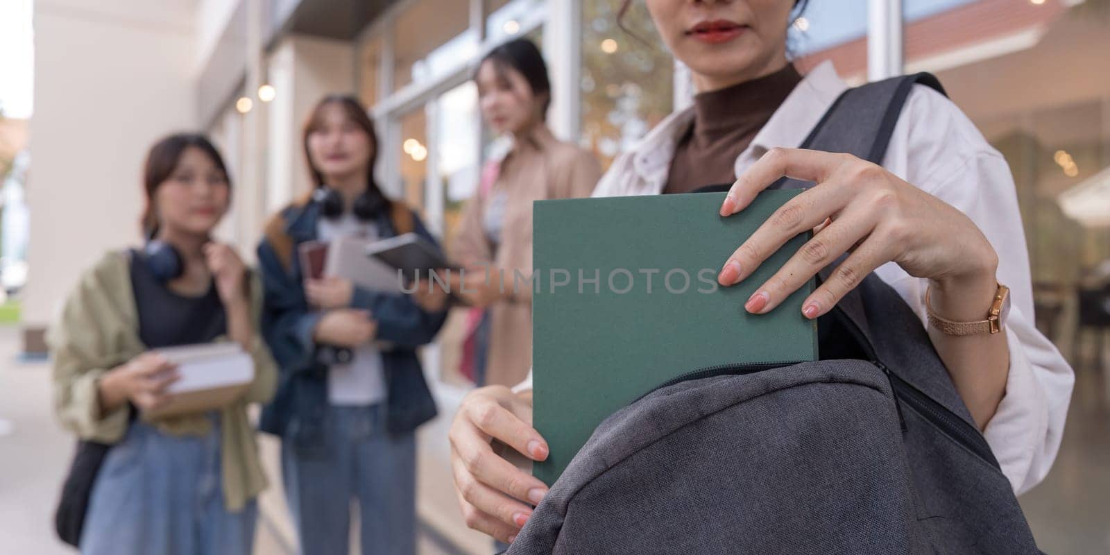 Happy university student going on a class at the university.