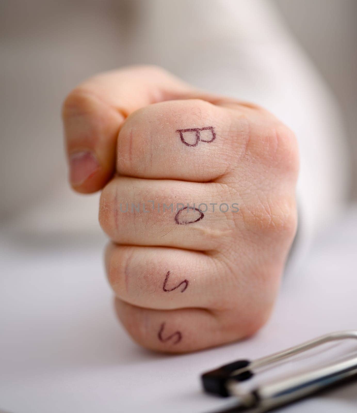 Male clenched fist in suit at office closeup. Aggressive career strategy angry negotiation strong riot solution for freedom victory leader decision boss tattoo control participation concept