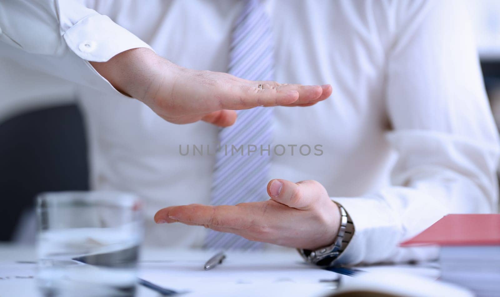 Male arms articulating during conference conversation in office closeup. Suggestion illustrate offer proposition bribe demand concept
