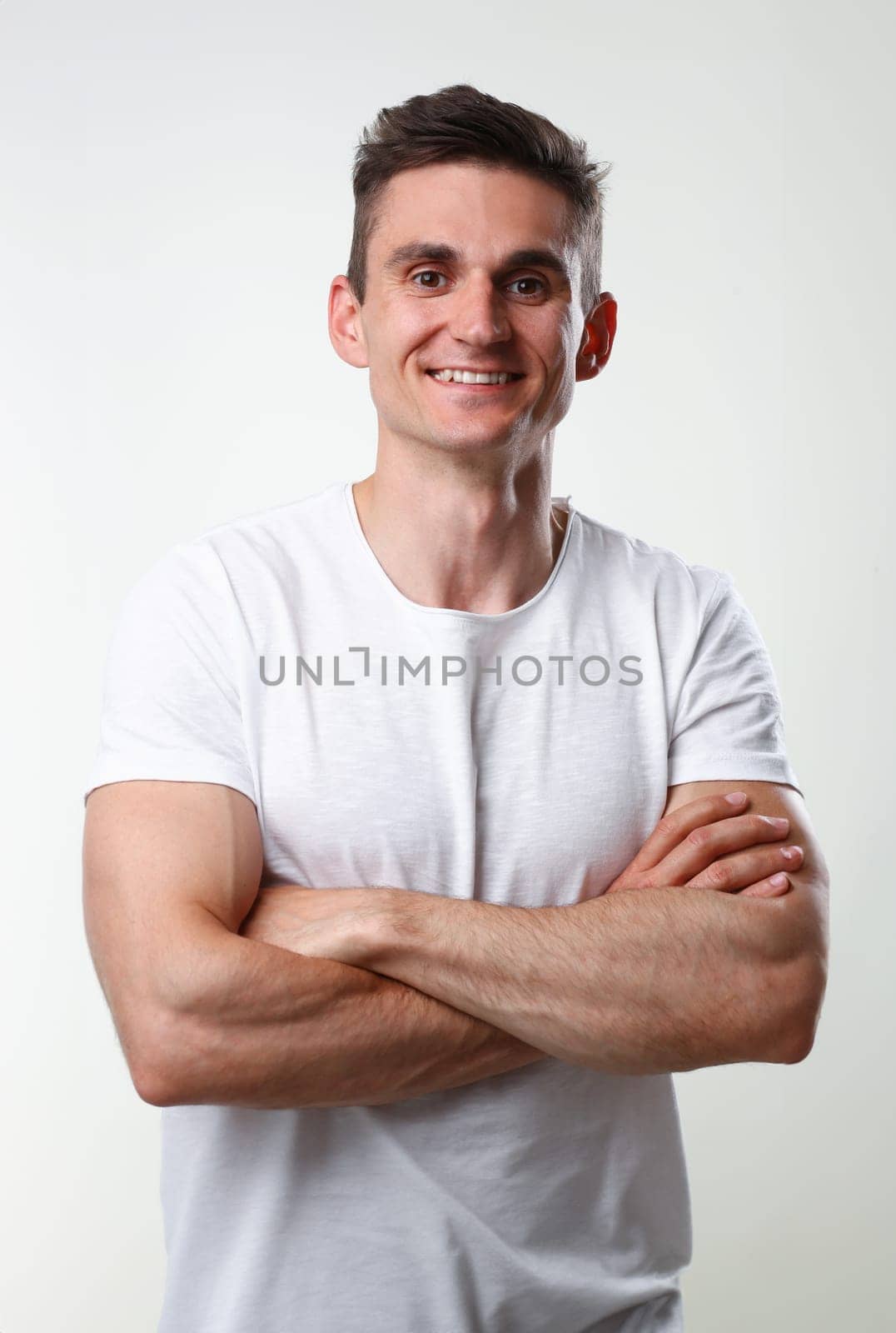Fitness man portrait cute in a white tank by kuprevich