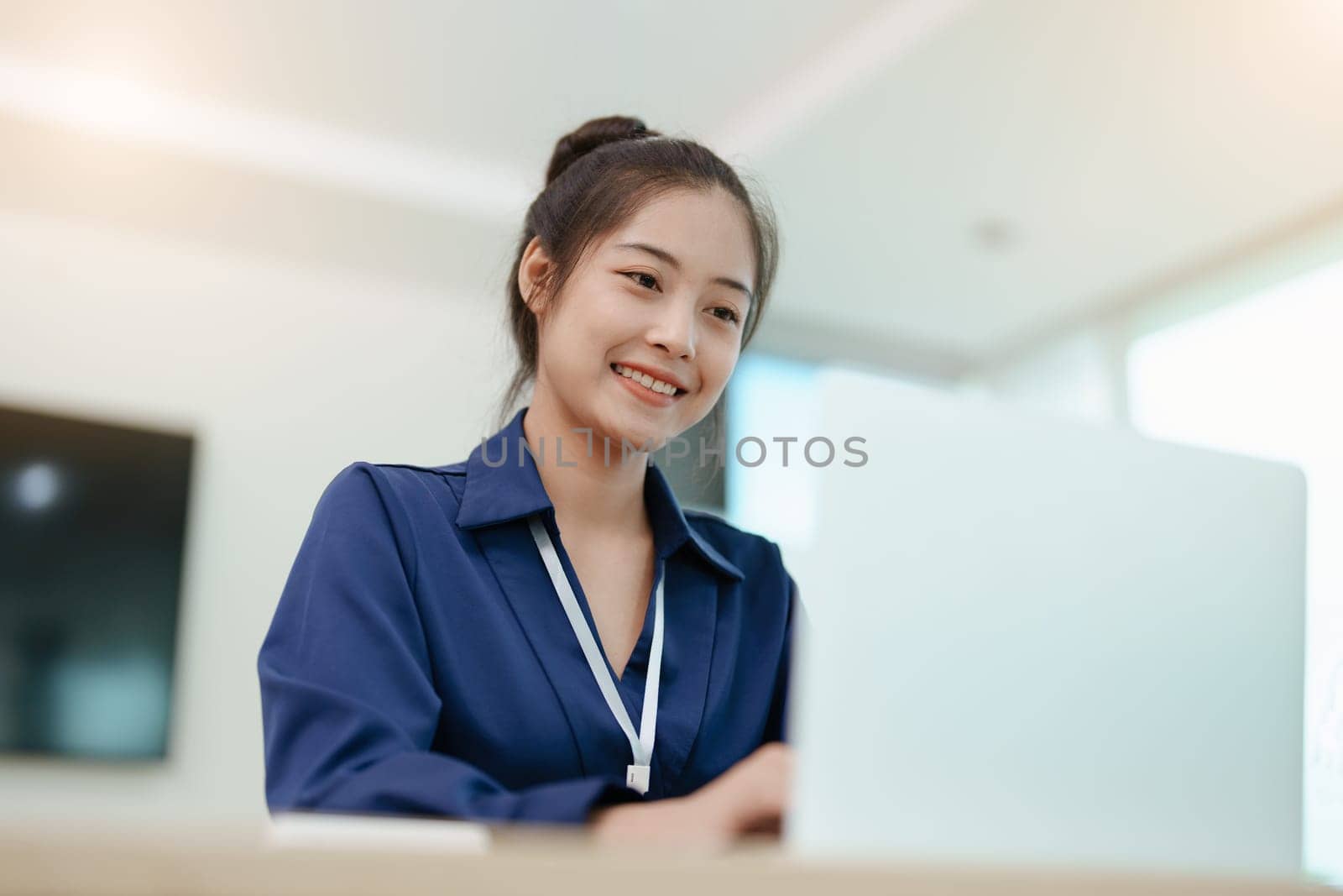 Young asian female work with financial papers at home count on calculator before paying taxes receipts online, planning budget glad to find chance for economy saving money, audit concepts. by Manastrong