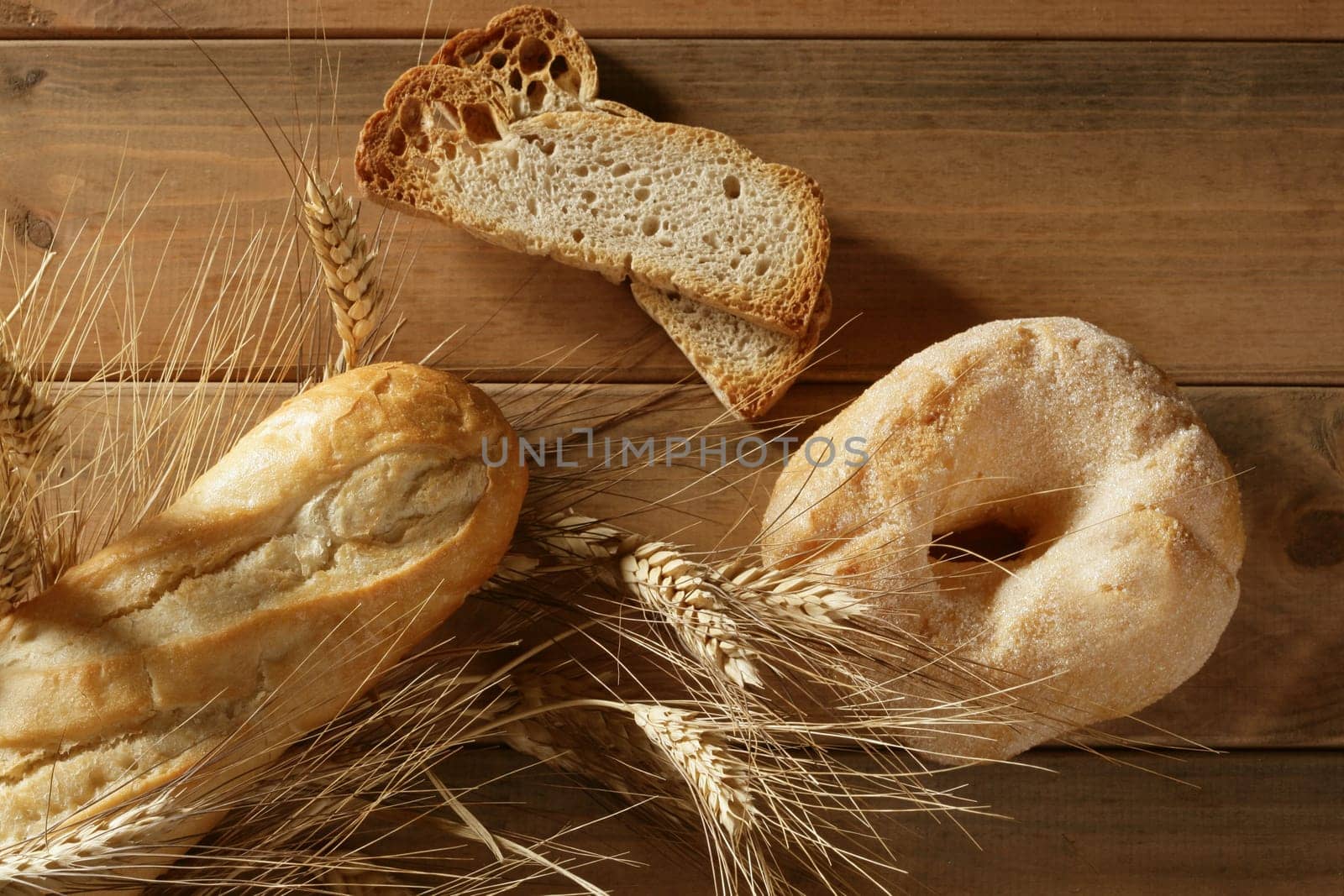 Delicious roll bakery with sugar and wheat ear spikes