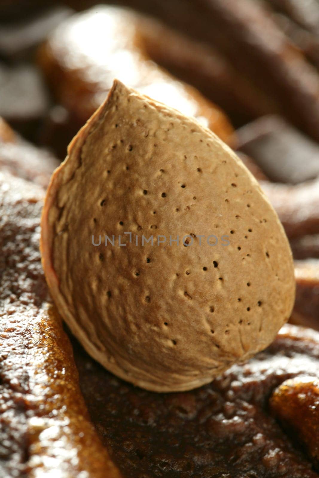 Almond nuts over chocolate, delicious golden fat calories food