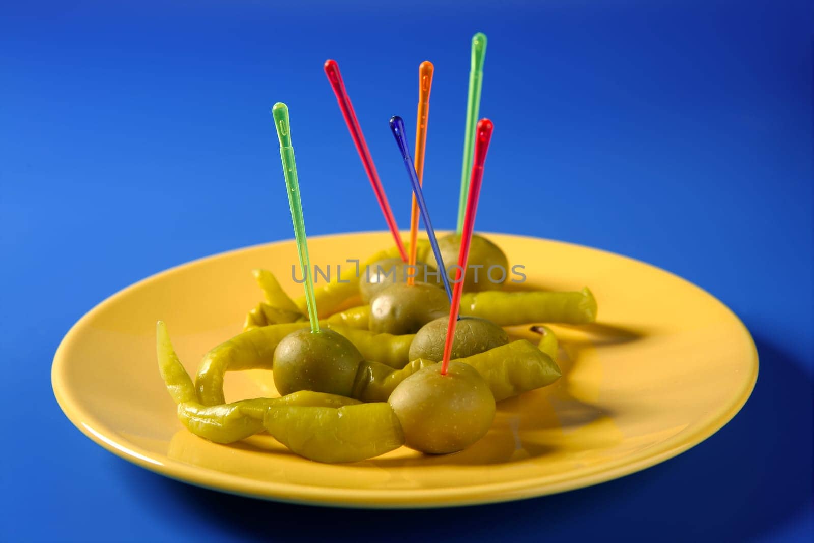 Tapas from Spain, olives and hot green pepper snack