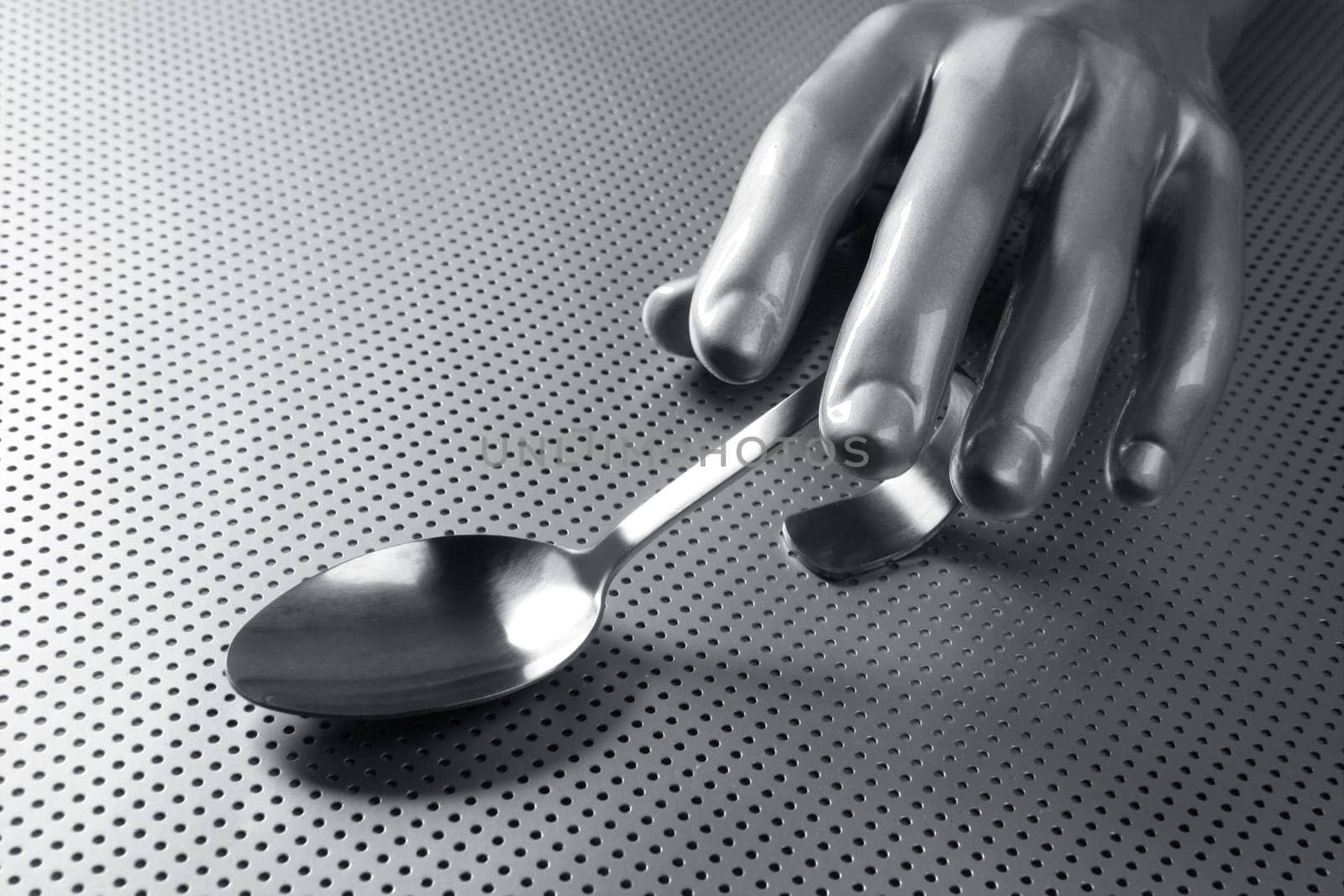 gray silver hand and spoon futuristic food modern metaphor
