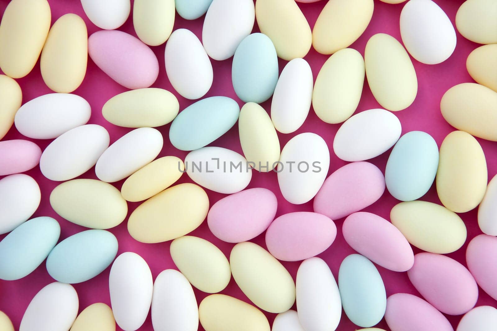 sugared almond sweet  candy pastel colorful on soft pink