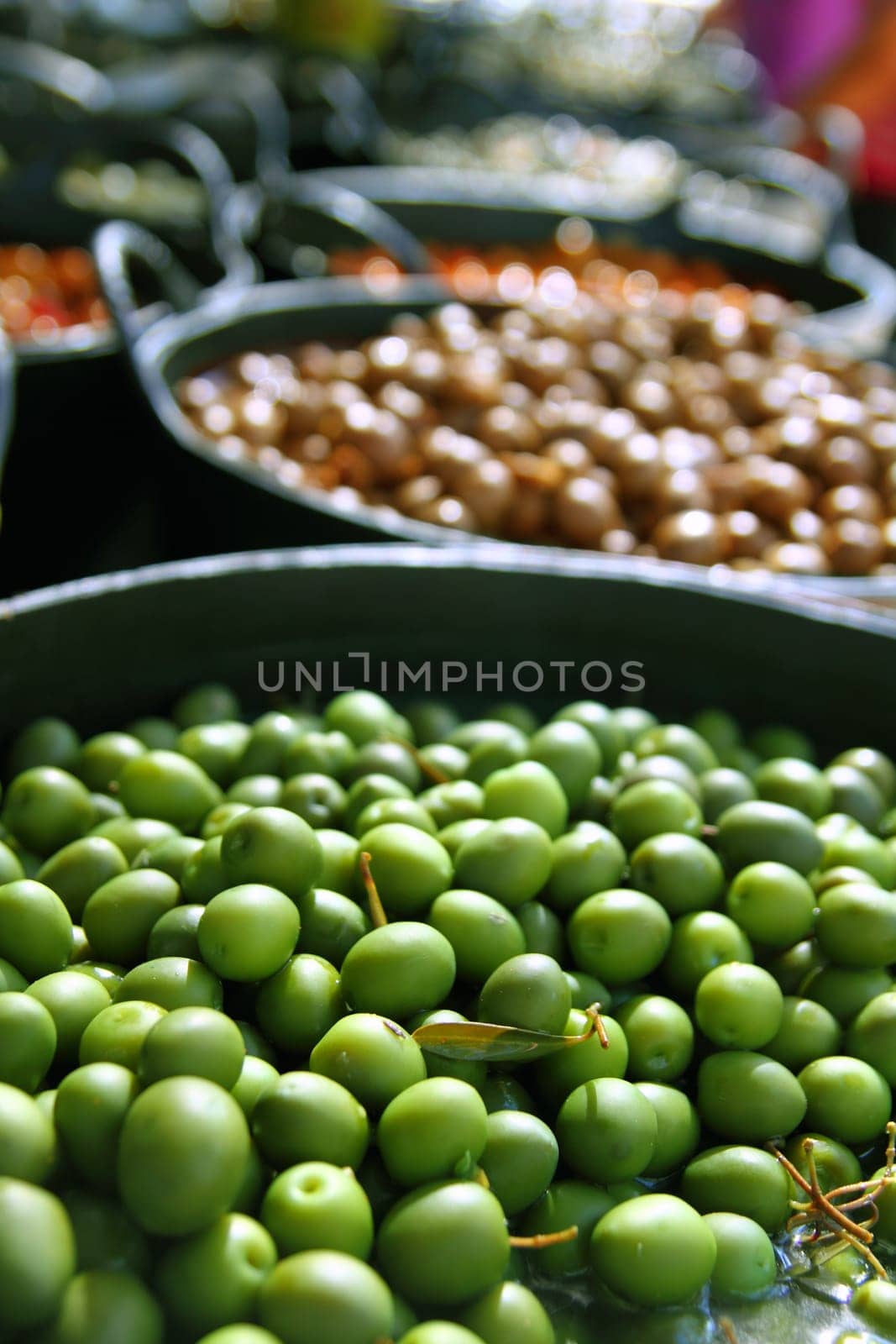 olives in pickling brine pattern background texture in market