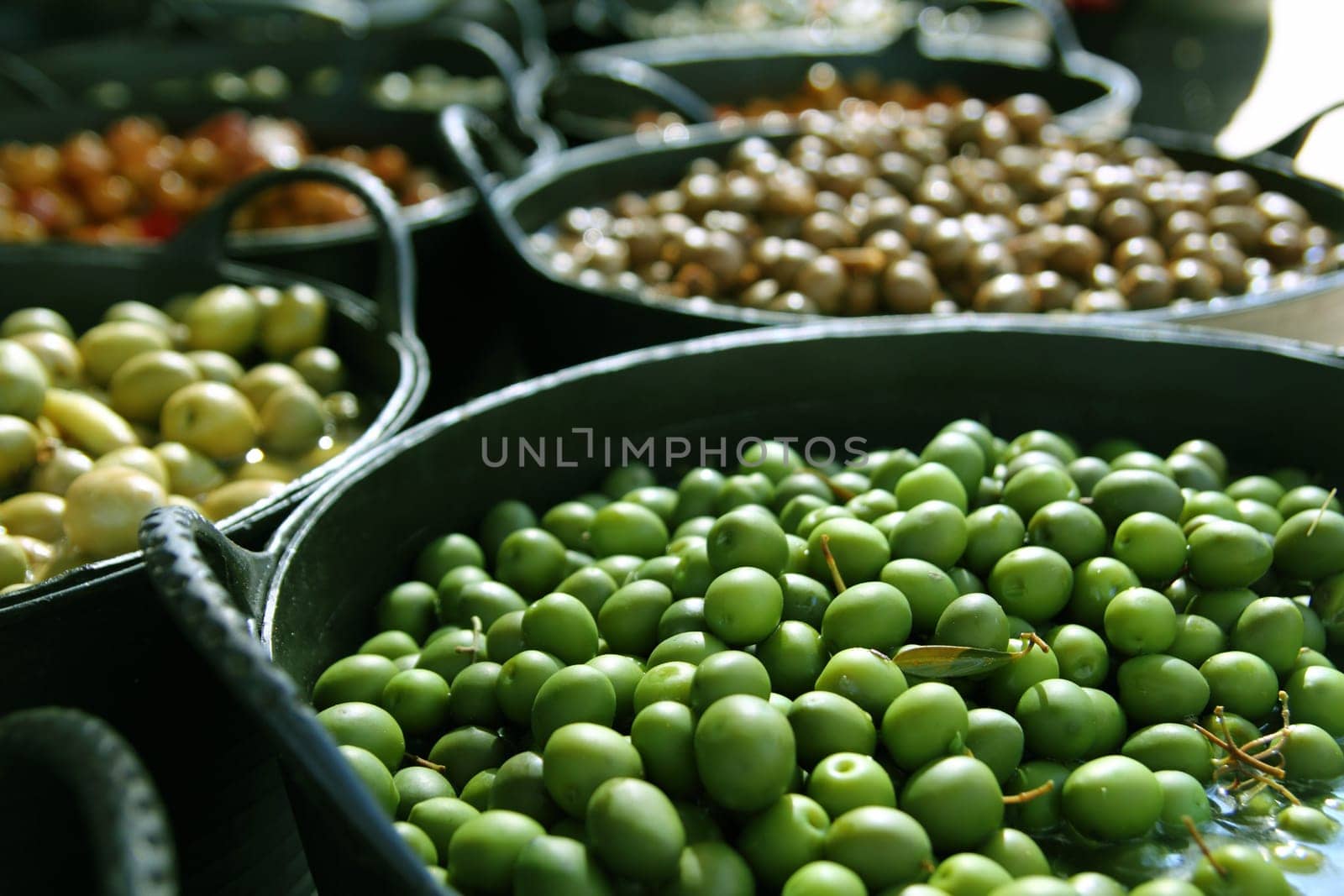 olives in pickling brine pattern background texture in market