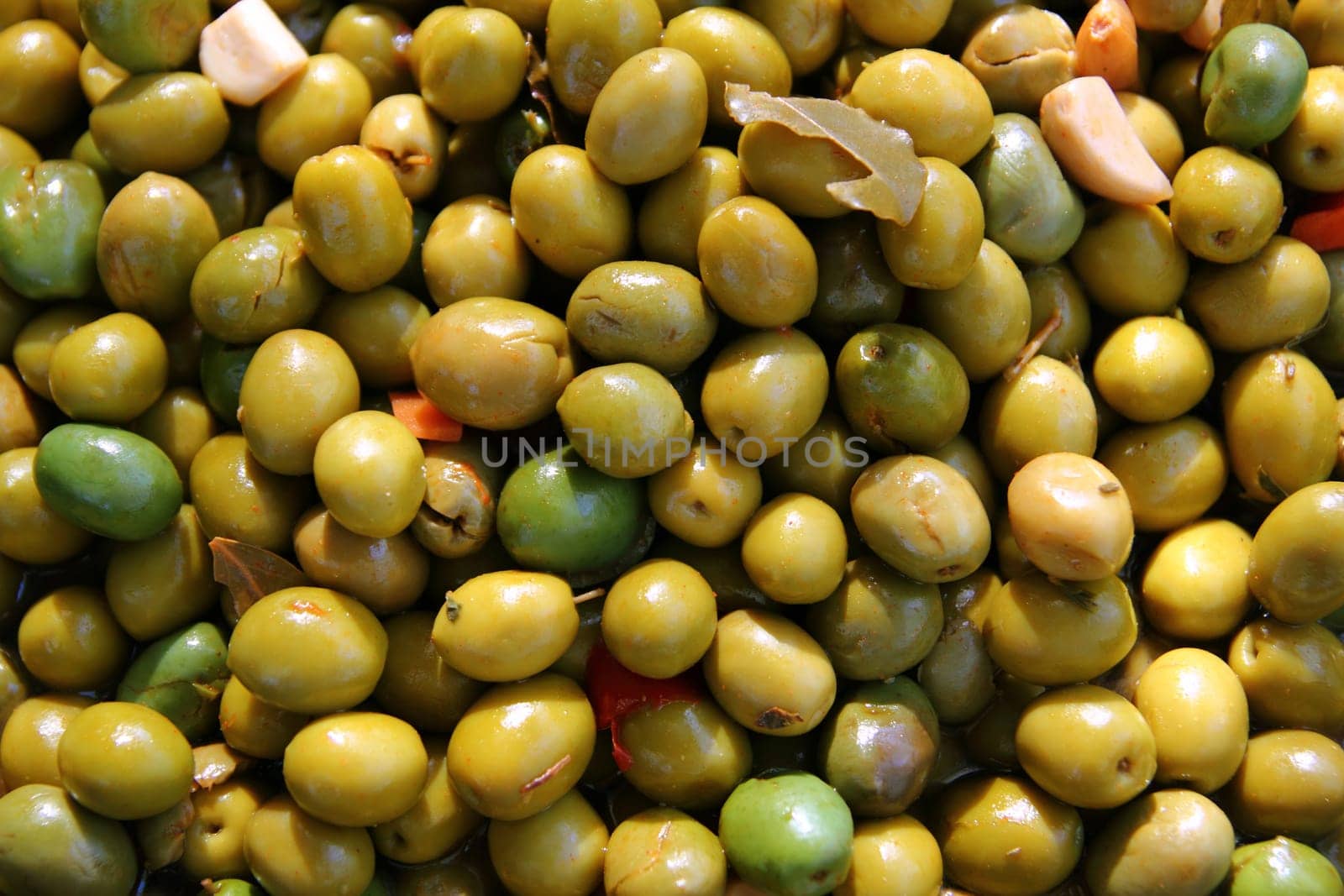 olives in pickling brine pattern background texture in market