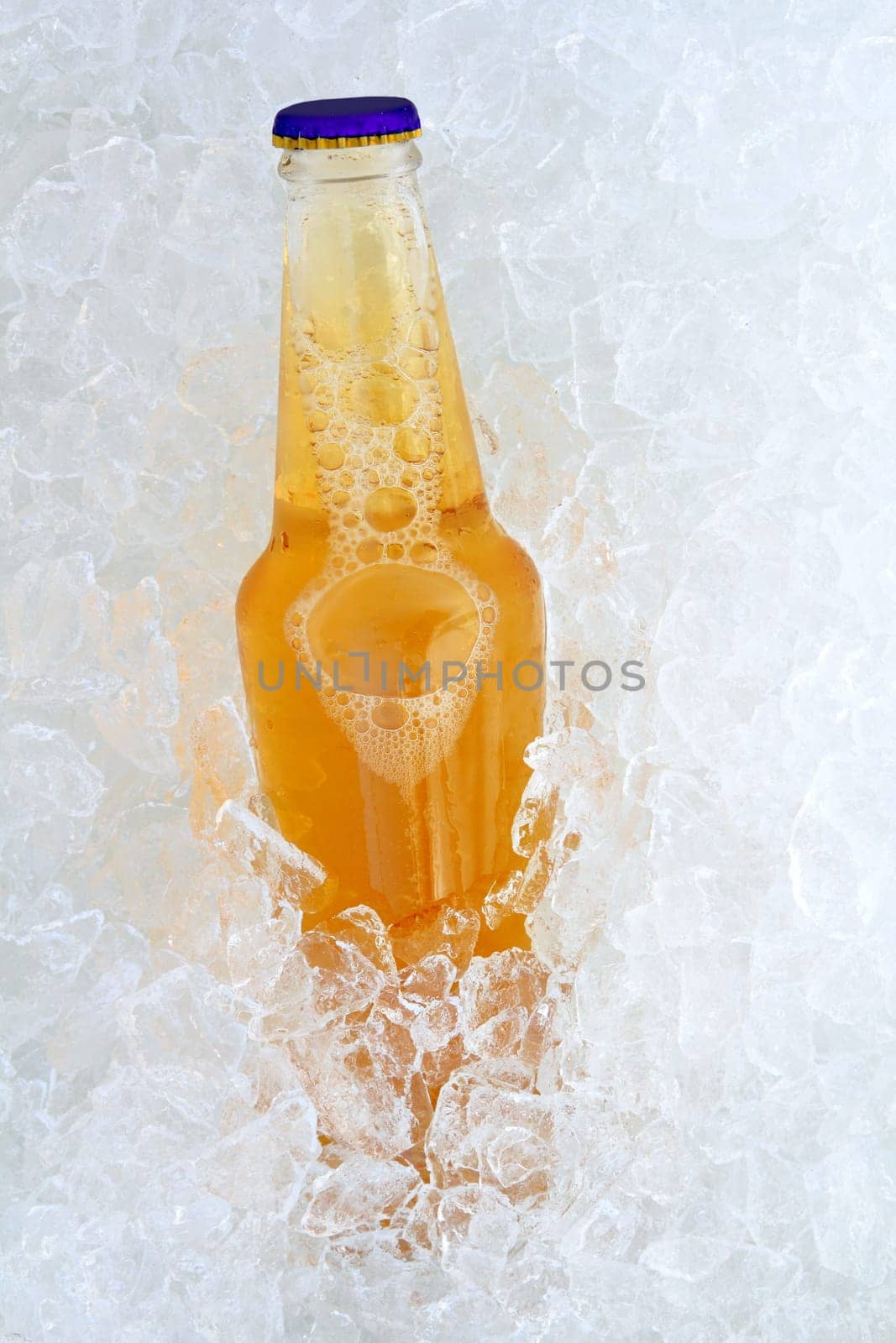 Beer bottle on ice fresh frosted glass transparency