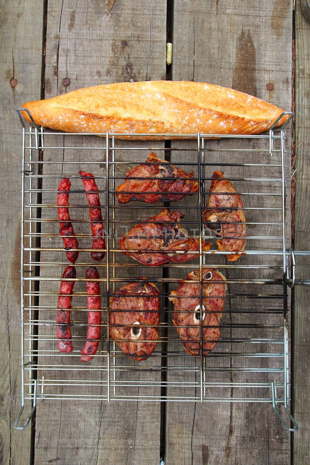barbecue sausages lamb meat grill bread on wooden table