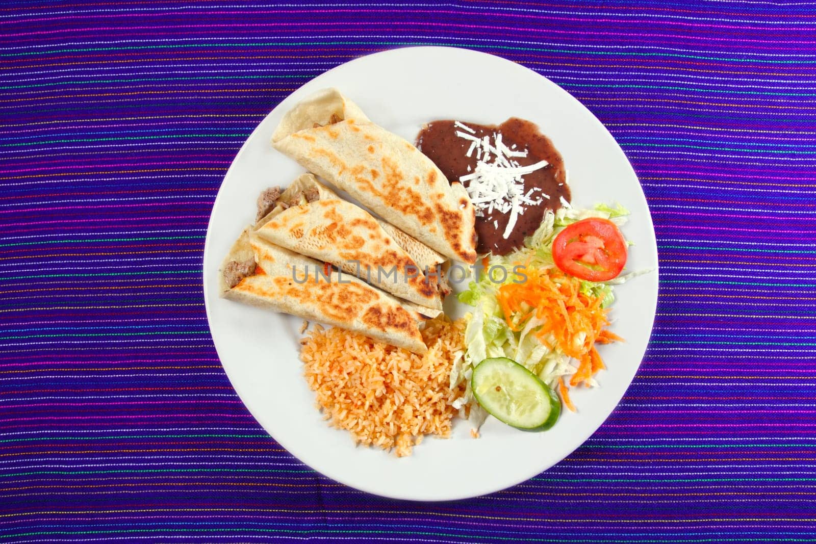 Burritos mexican rolled food rice salad and frijoles Mexico food