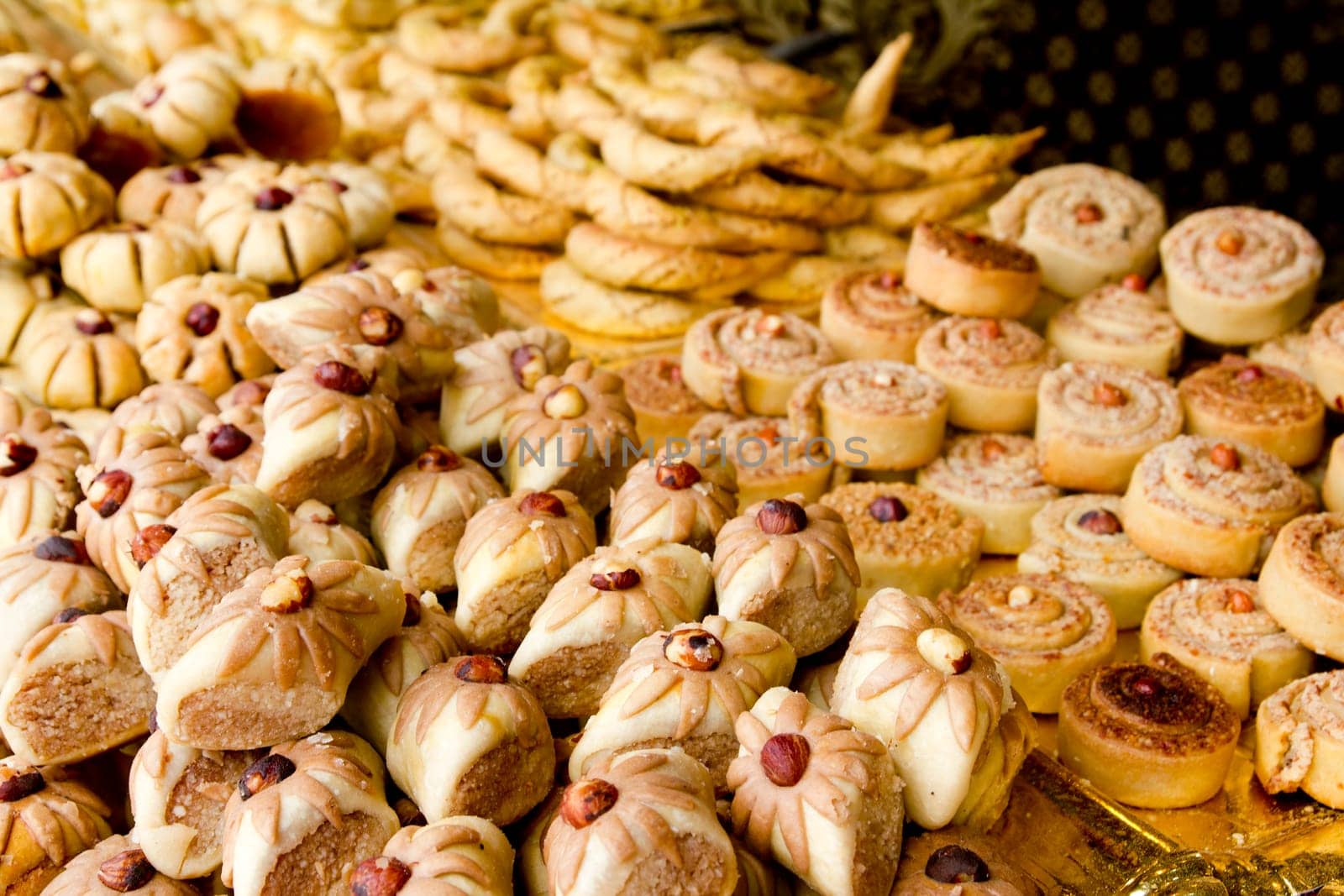 arab sweet pastries cakes stacked bakery with nuts