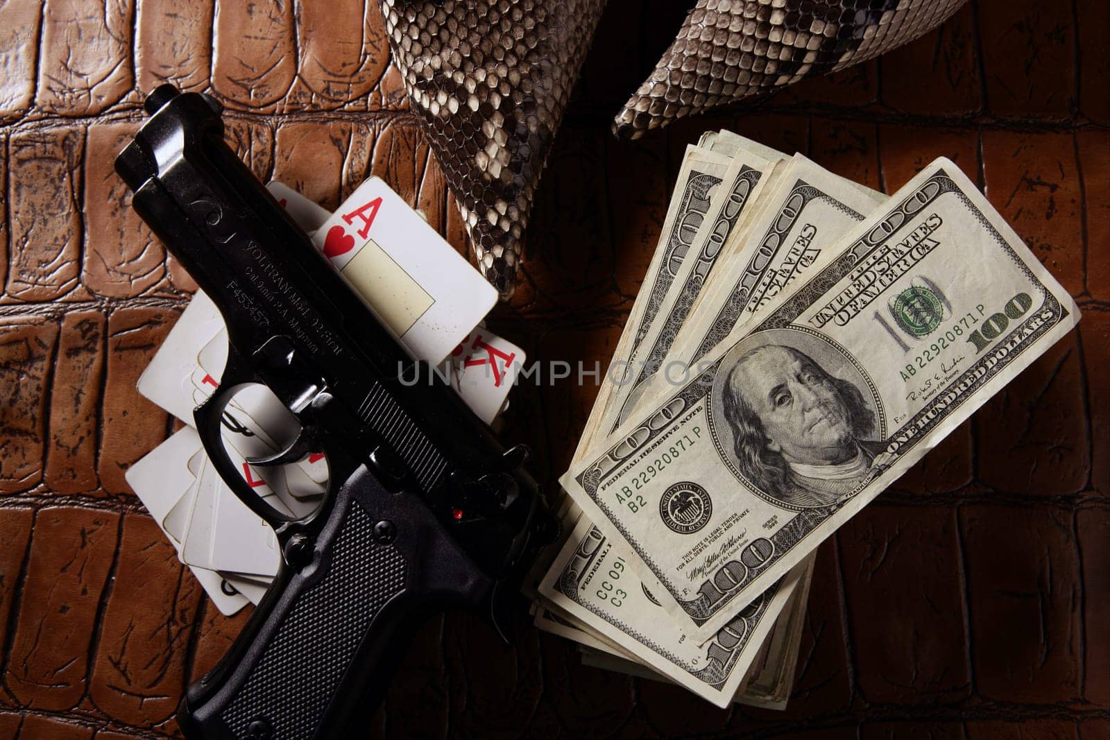 Dollar notes and gun, black pistol, mafia inspiration