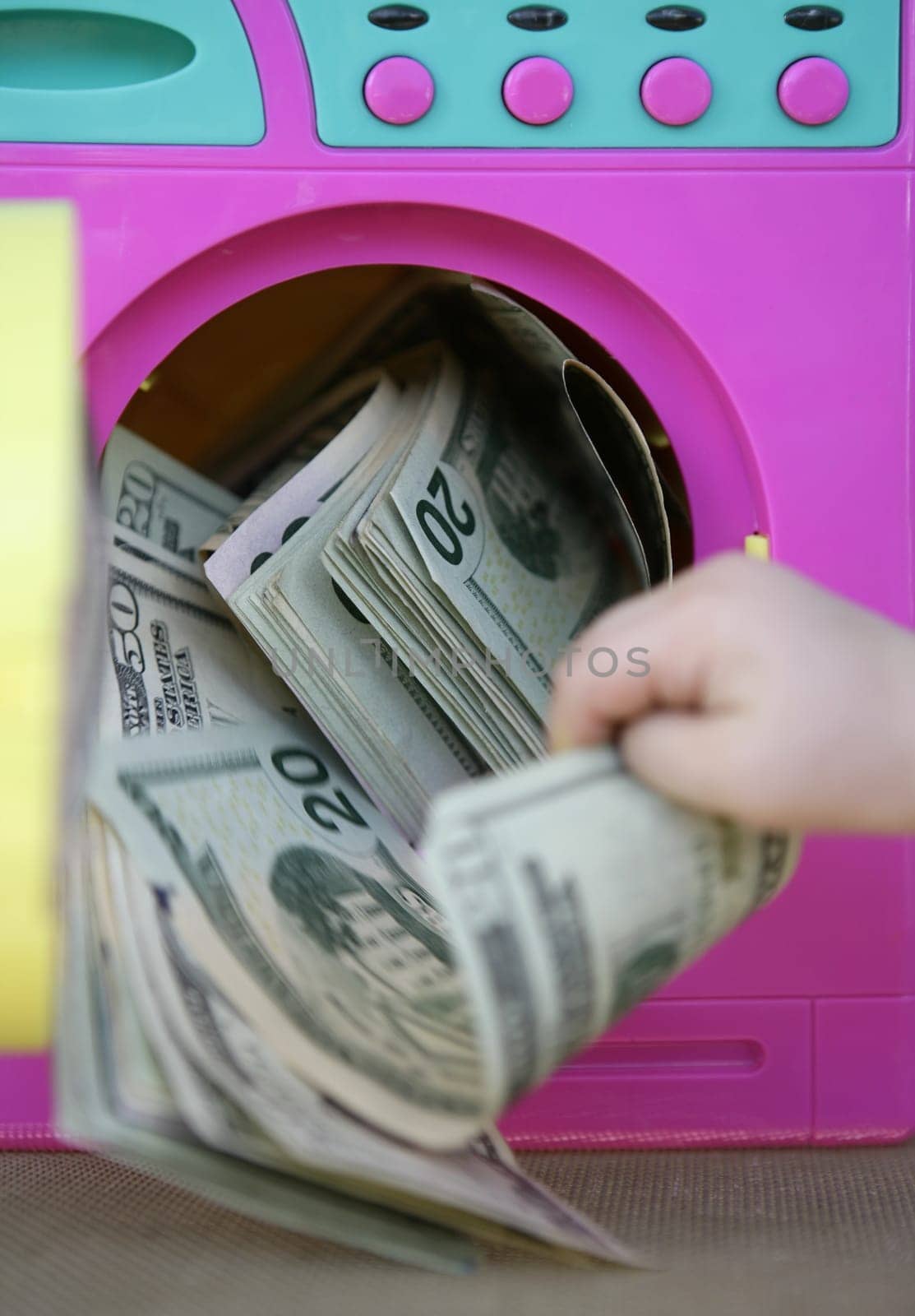 Cleaning black money dollar metaphor, laundry toy wahing machine