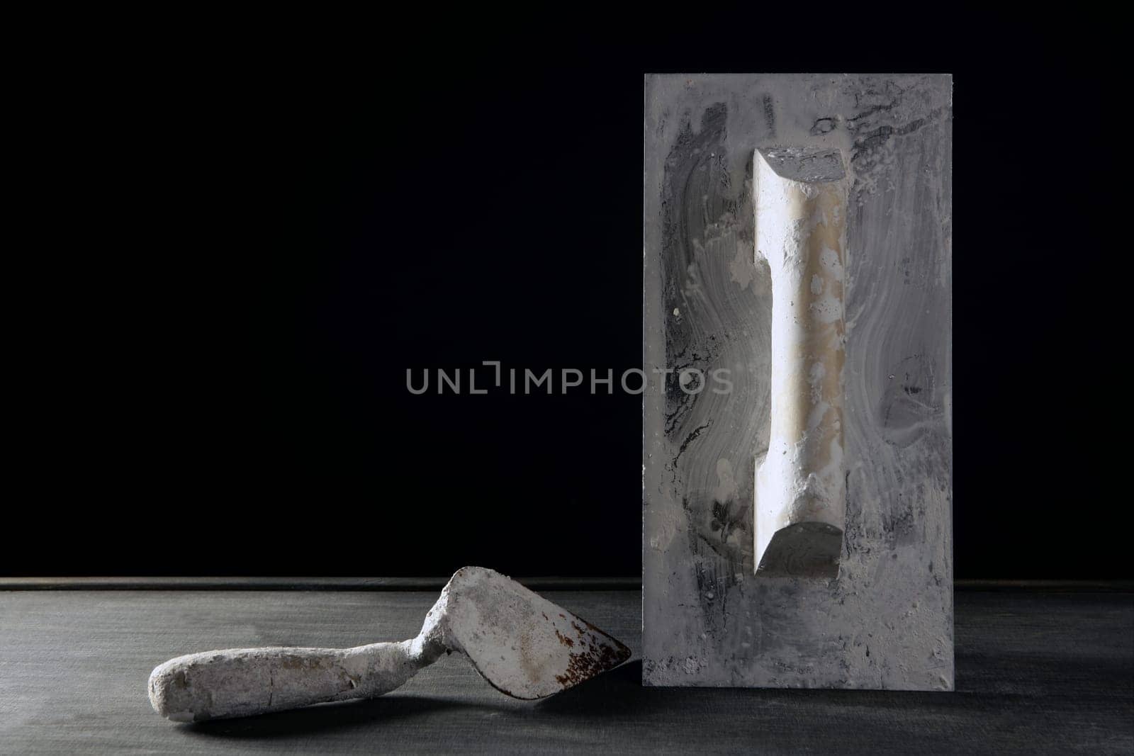 Hardware construction hand used dirty tools, studio over dark black wood