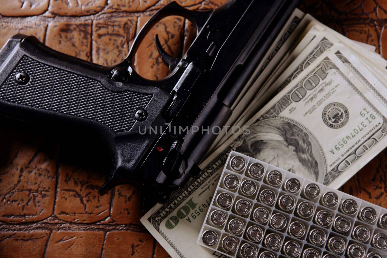 Dollar notes and gun, black pistol, mafia inspiration