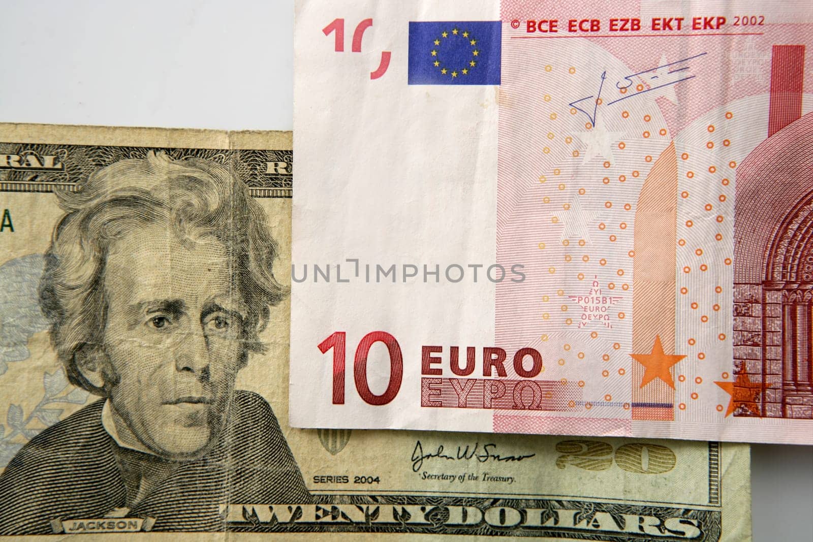 Dolar versus euro notes, finance metaphor image
