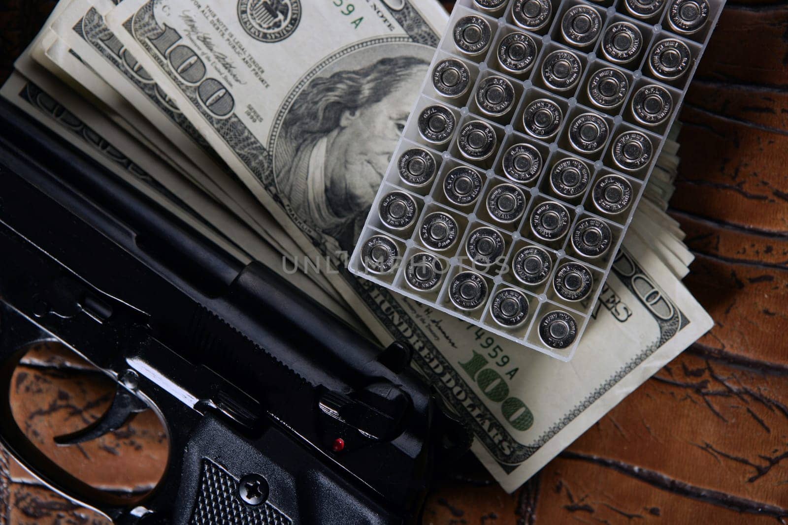 Dollar notes and gun, black pistol, mafia inspiration