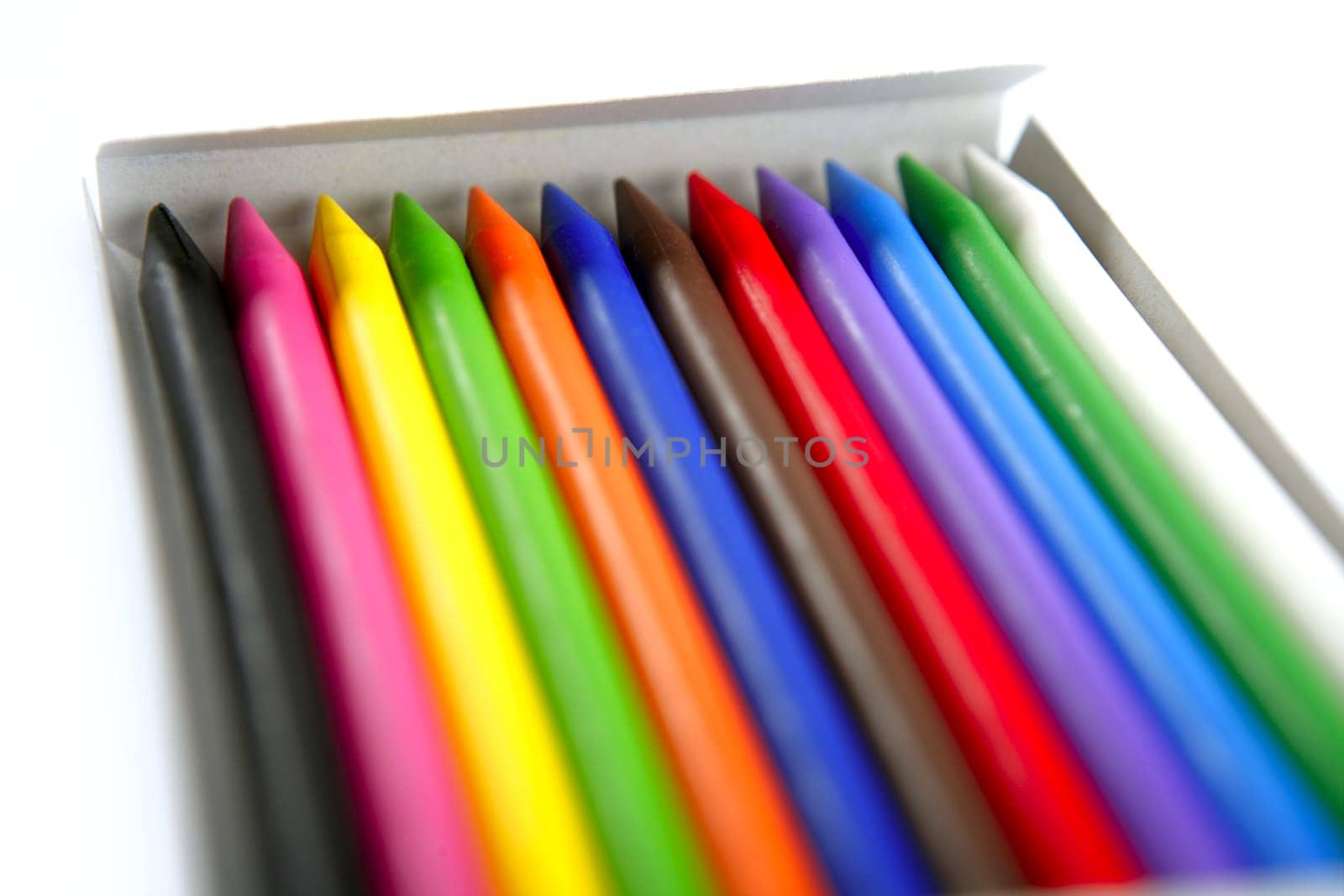 Colorful set of pencil in a box over white