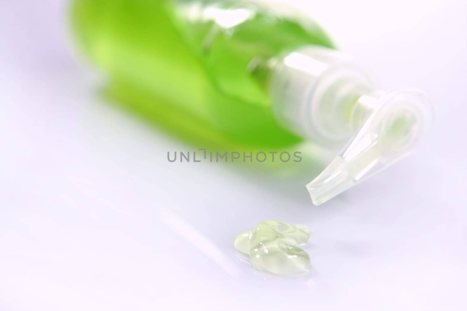 Aloe vera green gel transparent bottle, studio shot