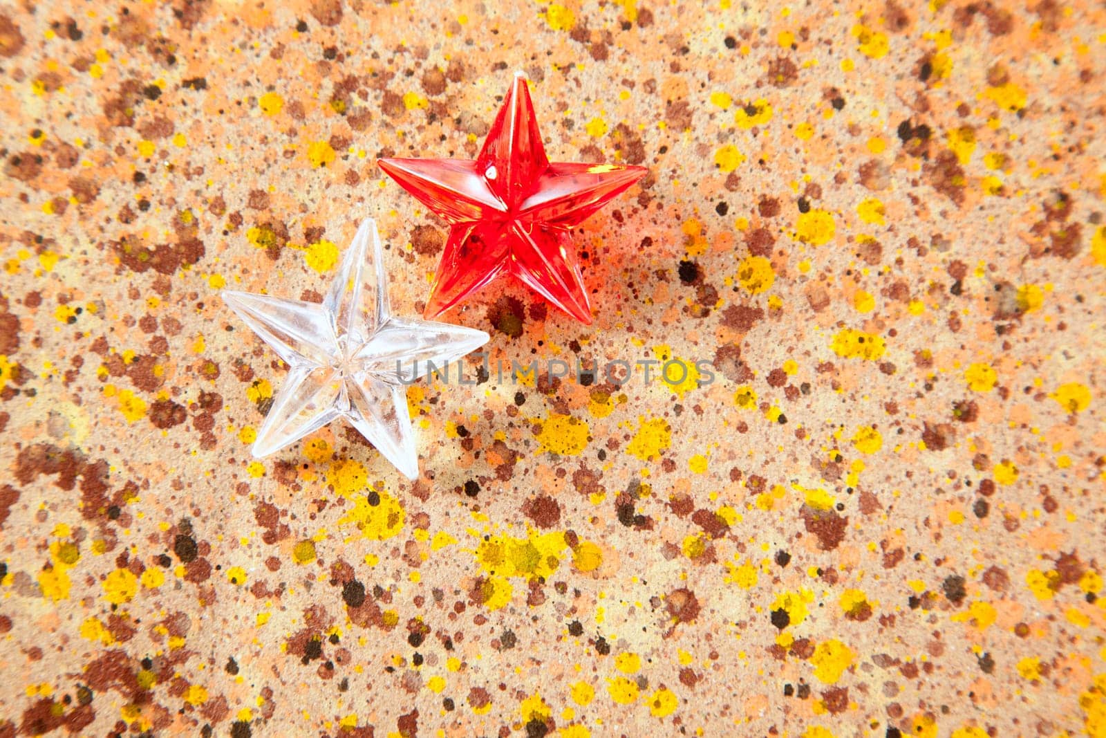 christmas prism stars on recycled paper background