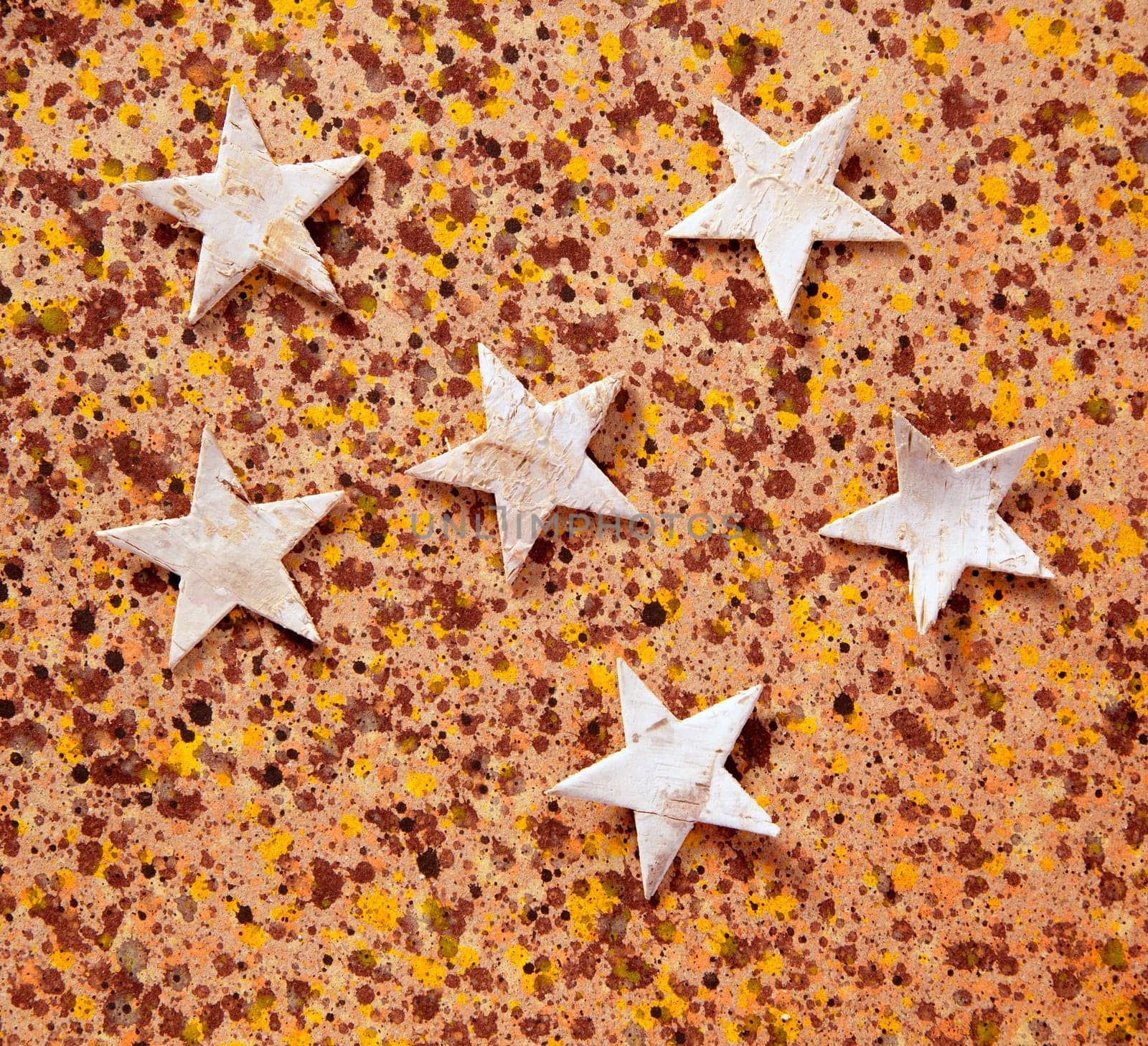christmas stars background on recycled warm paper