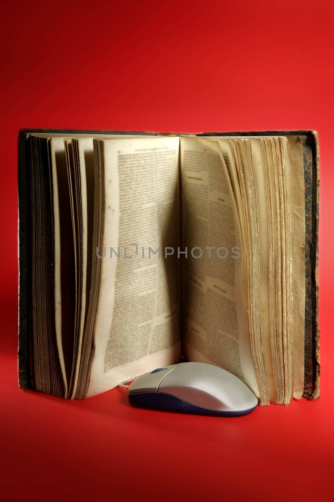 Old aged  book and computer knowledge technology evolution