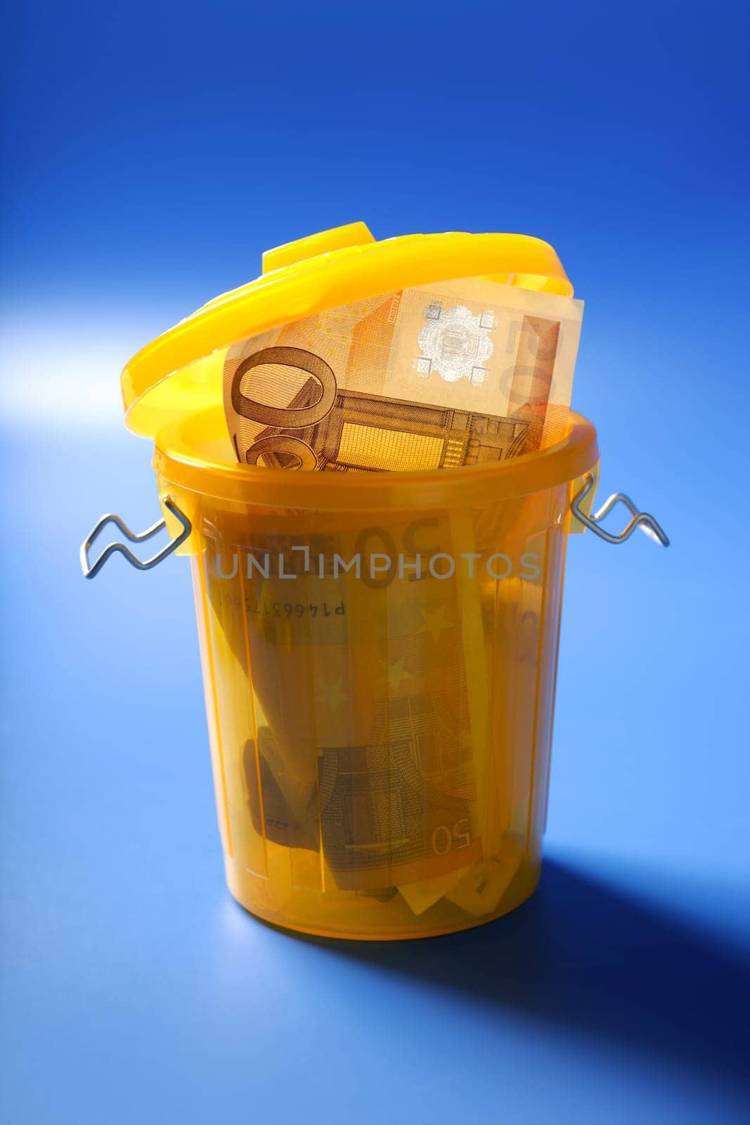 Fifty euro currency note on the trash, crisis, bankruptcy, devaluation