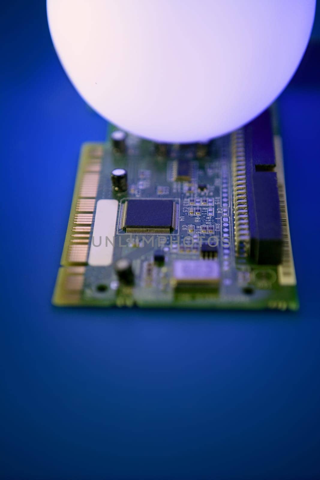 Glowing light sphere lighting a technologic electronic circuit