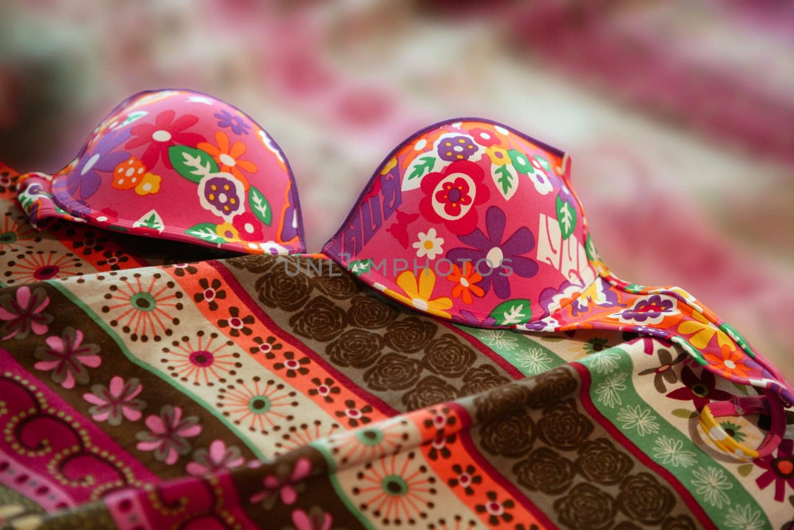colorful woman underwear over a messy bed, love sex metaphor