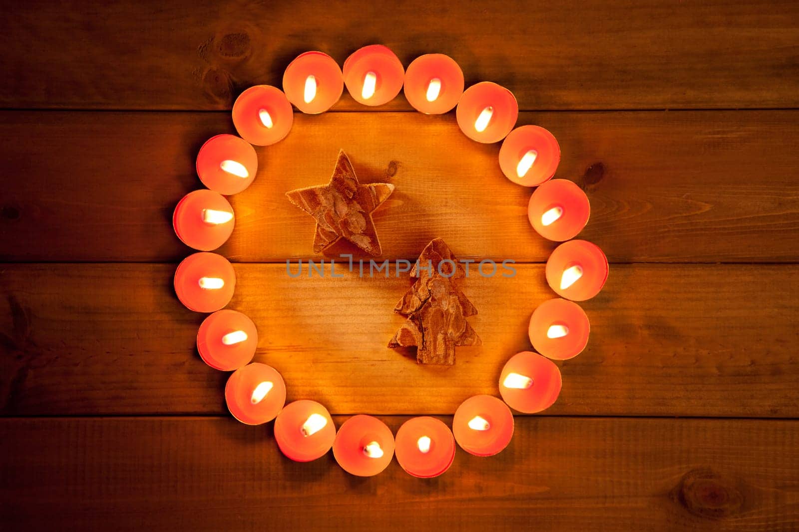 christmas candles circle over wood and tree star symbol