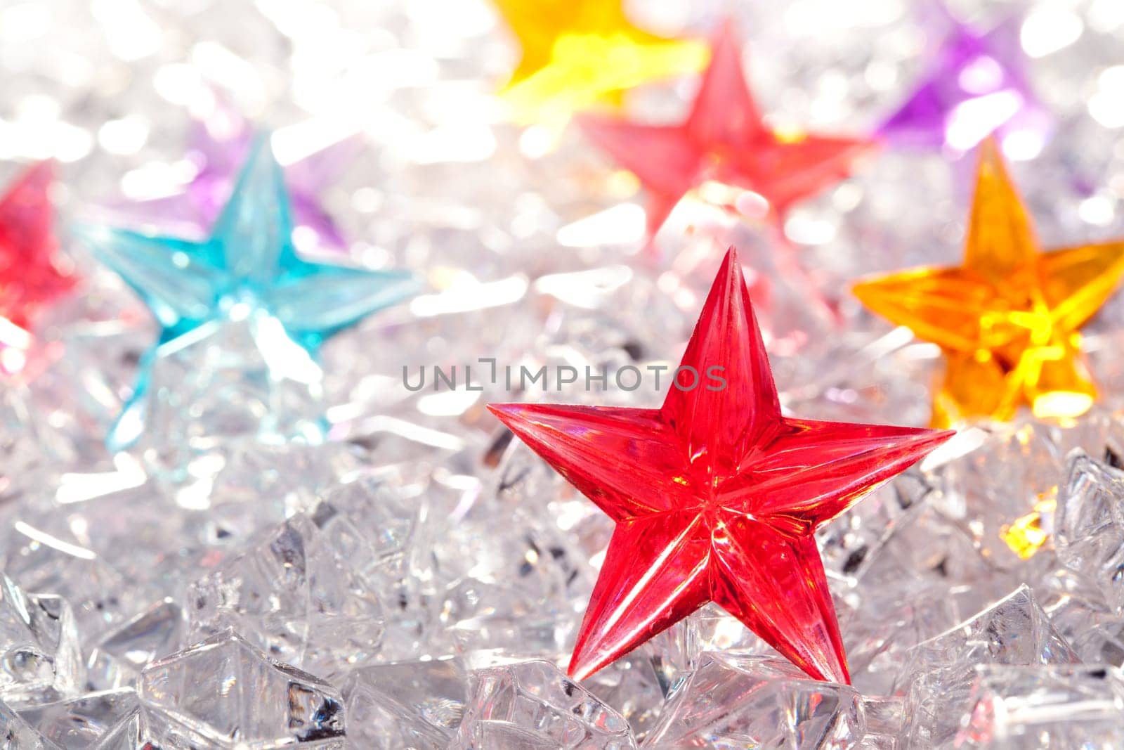 christmas red glass star on winter ice background