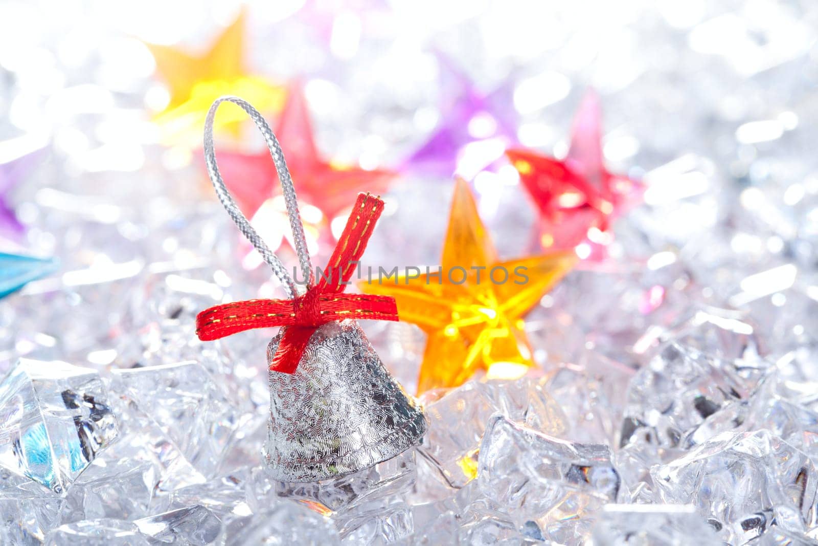 christmas silver bell on winter ice background