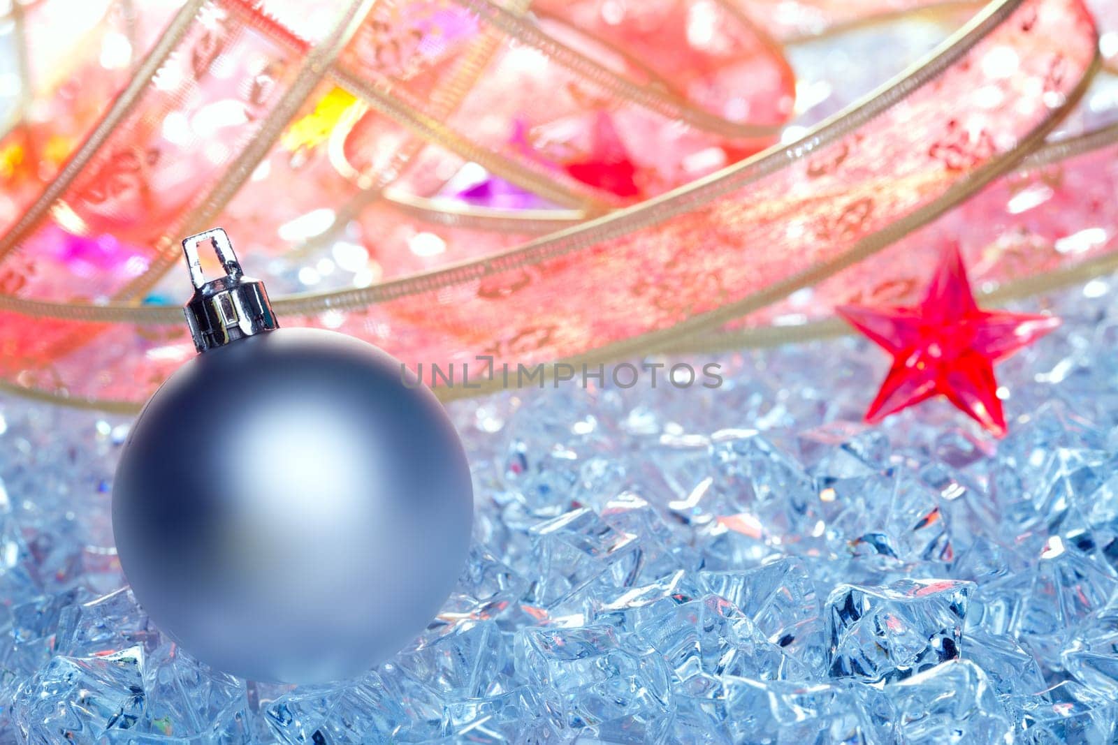 christmas baubles silver on winter ice with star symbol and ribbon