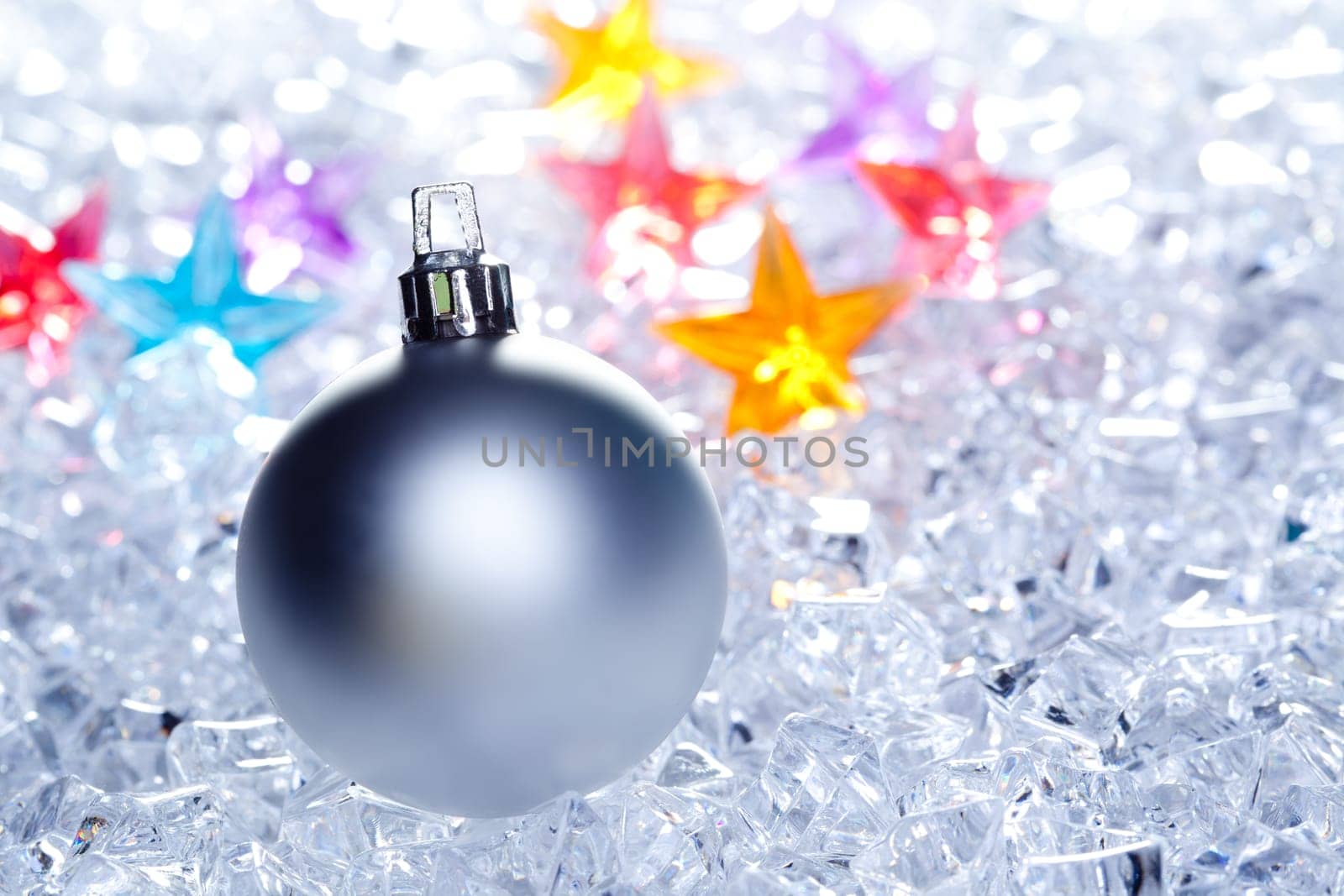 christmas baubles silver on winter ice with star symbol shapes