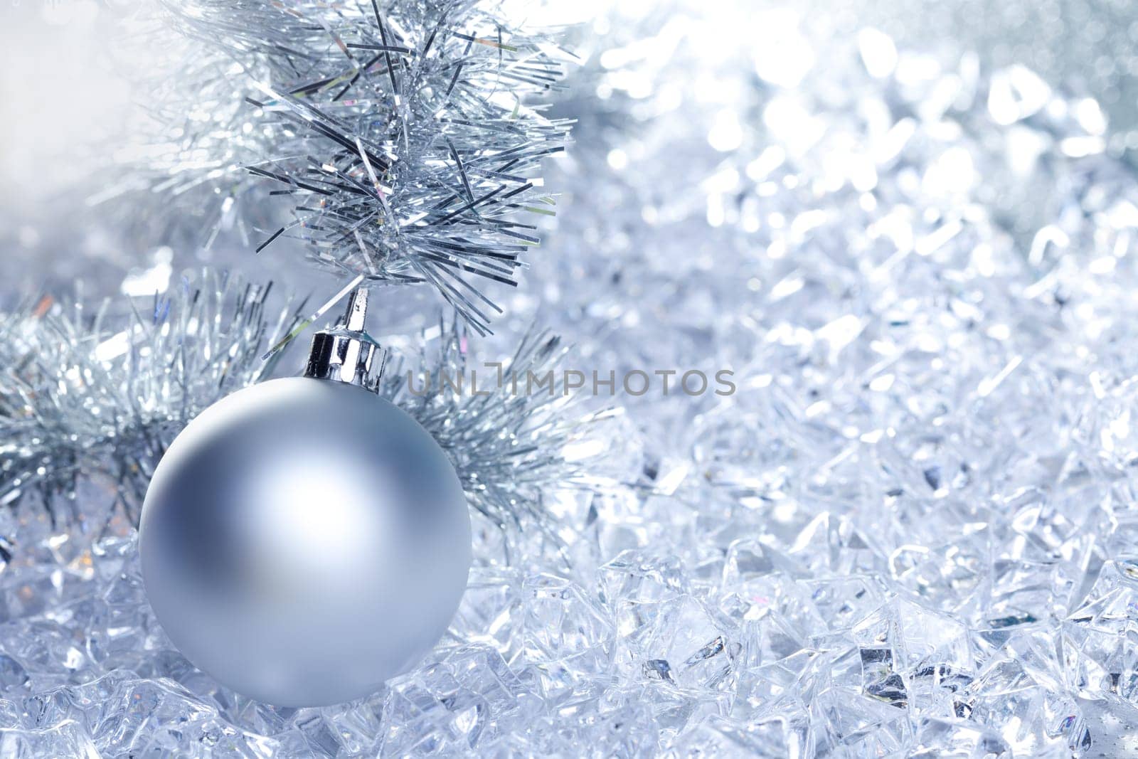 christmas baubles silver on winter ice with star symbol shapes