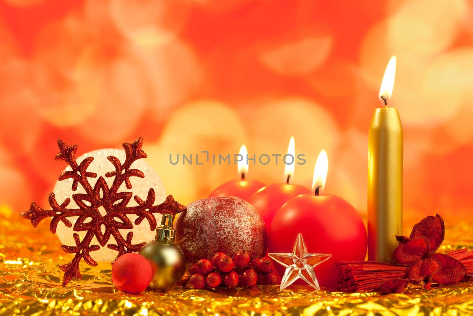 christmas red snowflake with candles on bokeh lights background