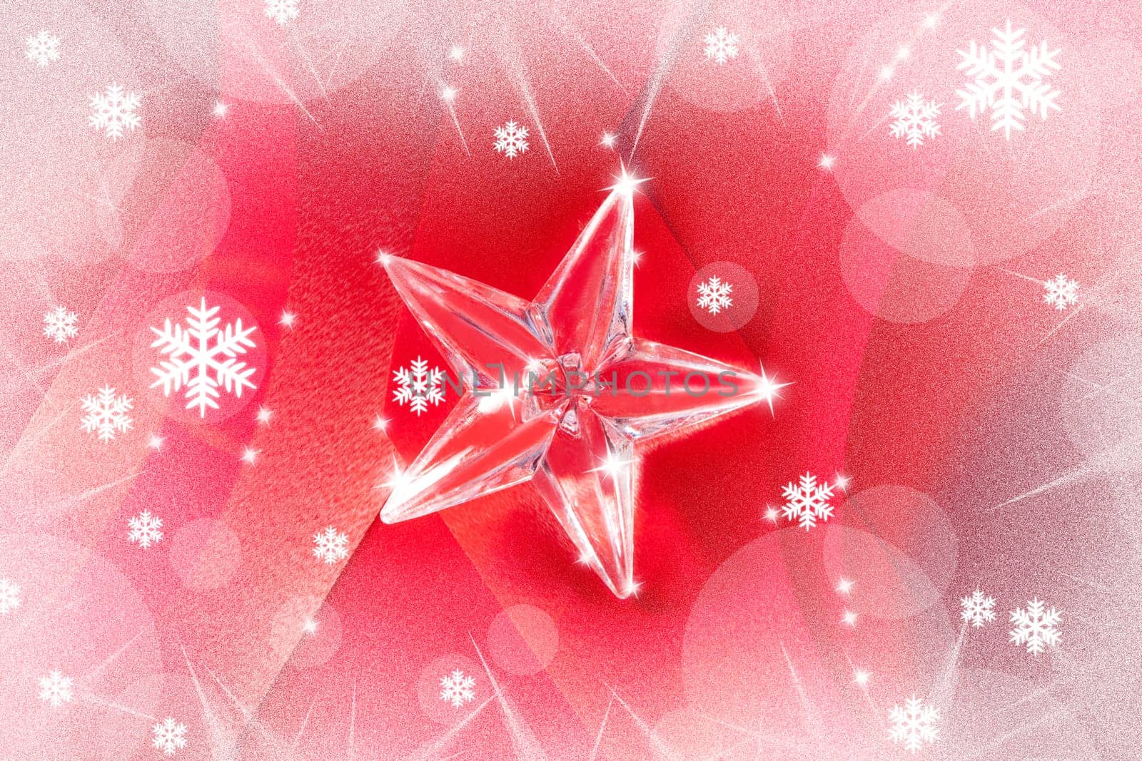 christmas glass star on red ribbon background