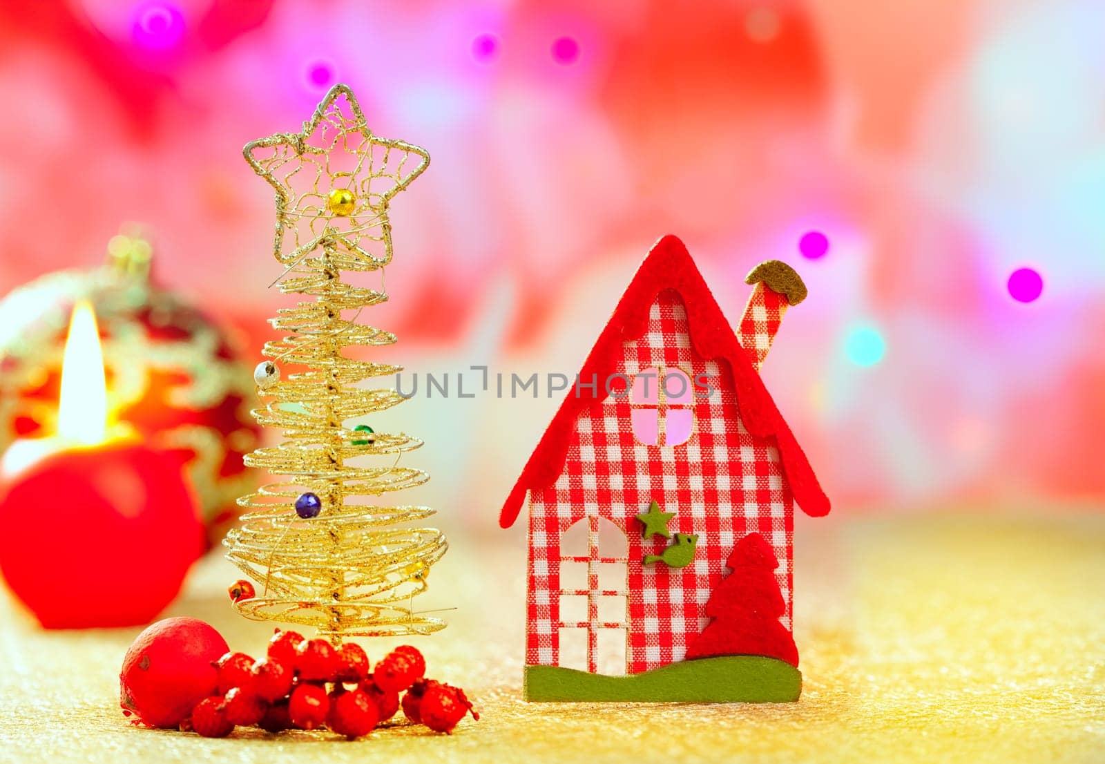 Christmas golden tree and red vichy house in blurred lights