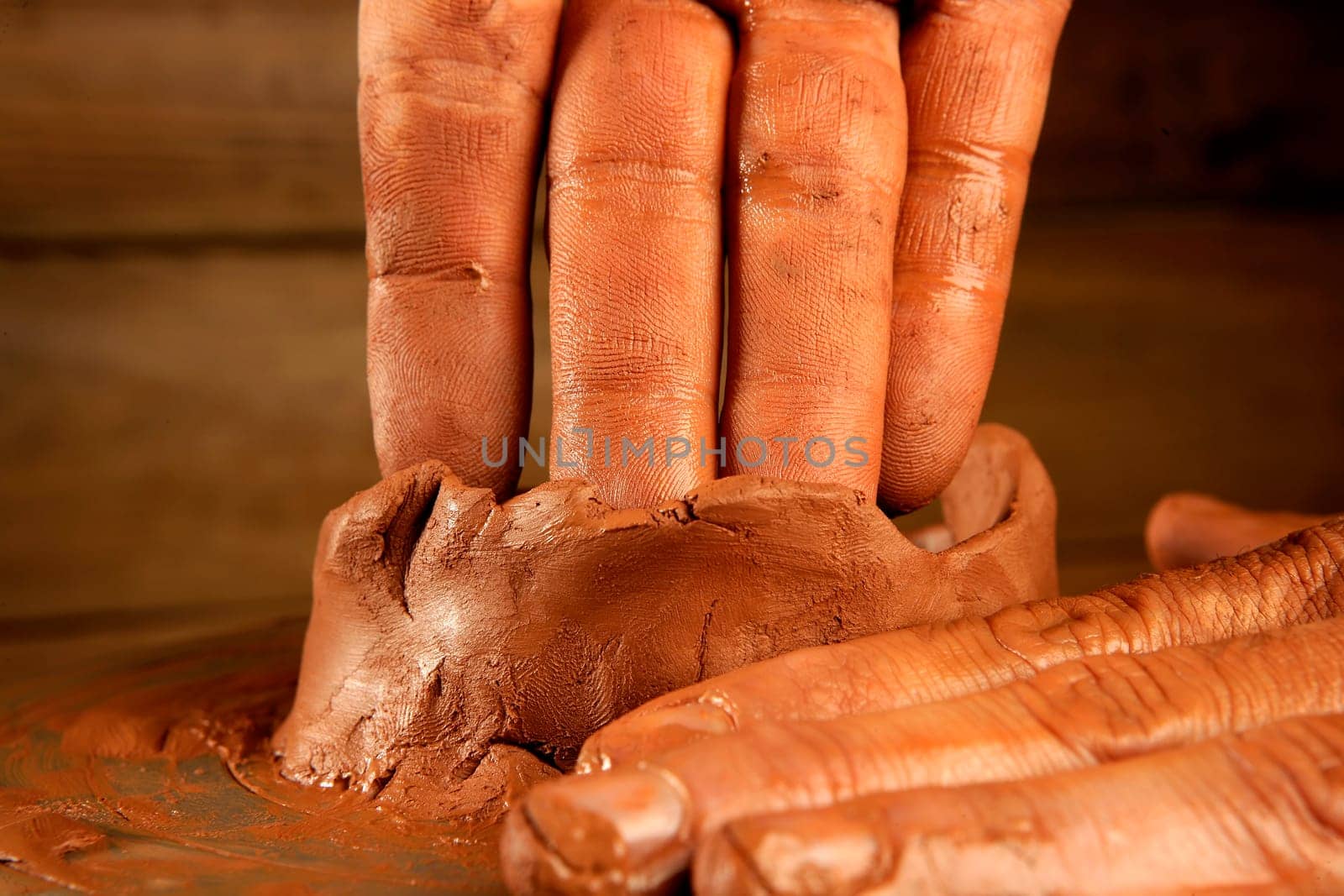 pottery craftmanship red clay potter hands work finger closeup