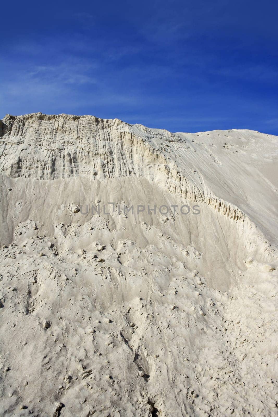white sand mound quarry like a moon landscape