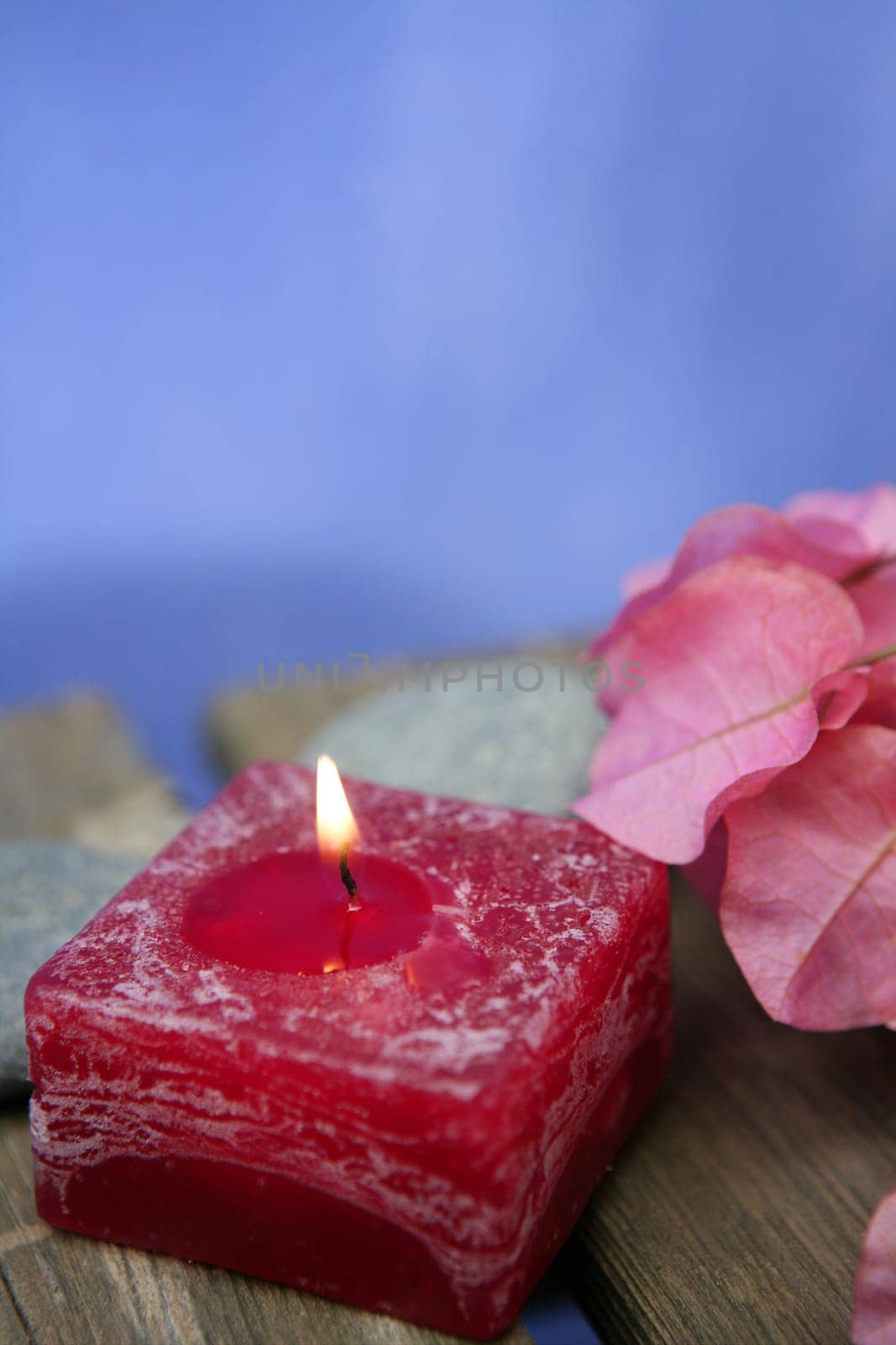 Natural theraphy, stones, and candles over wood