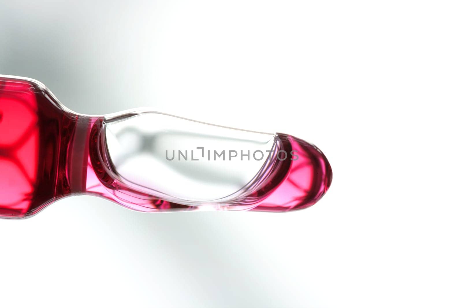 Glass ampoule with red liquid medicine inside