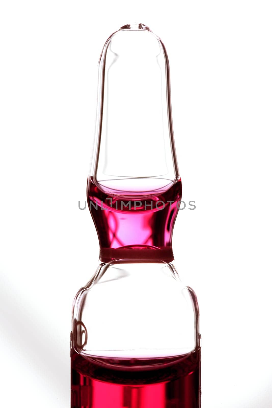 Glass ampoule with red liquid medicine inside